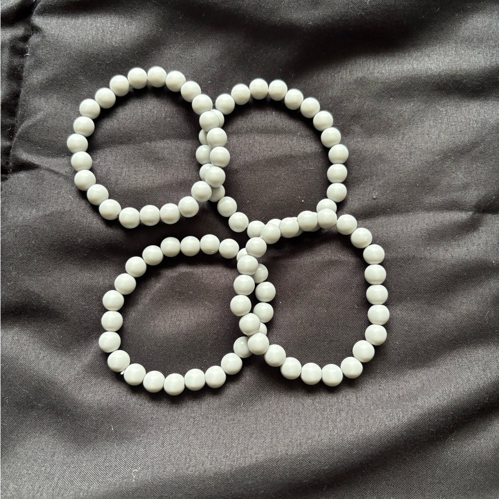 Set of Four White Beaded Bracelets